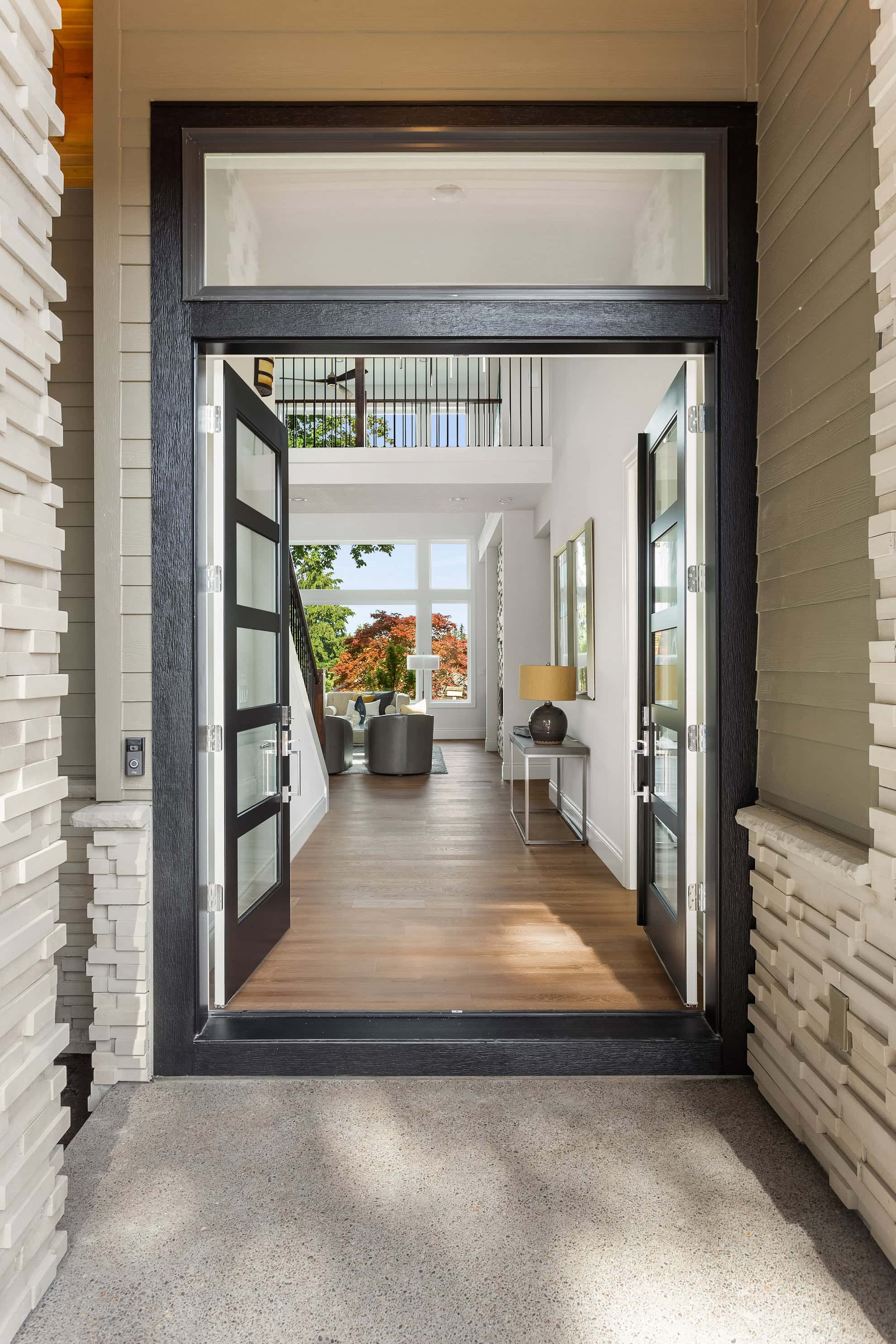 Open door leading into a stylish home.