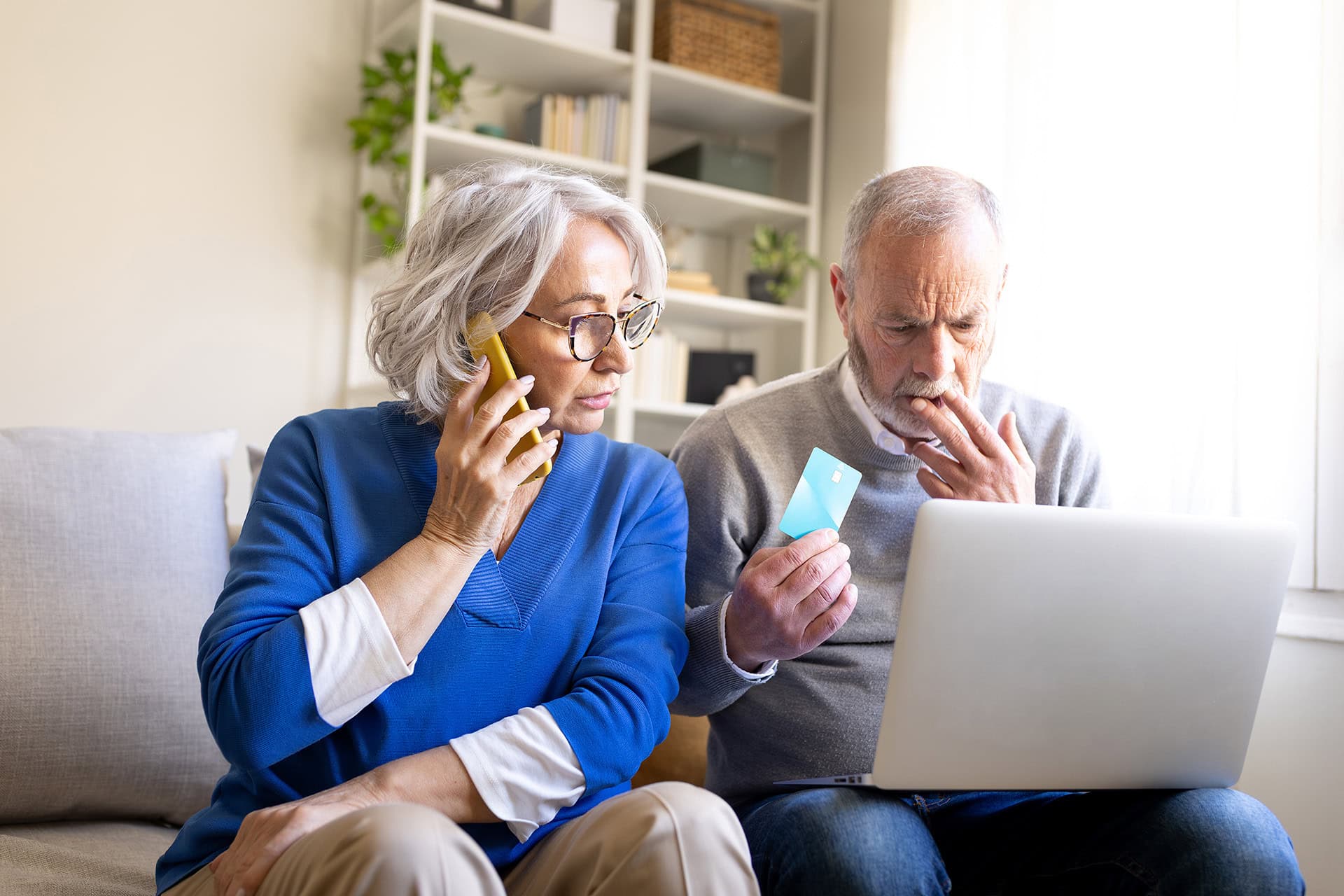 Couple reviewing their finances on a laptop computer